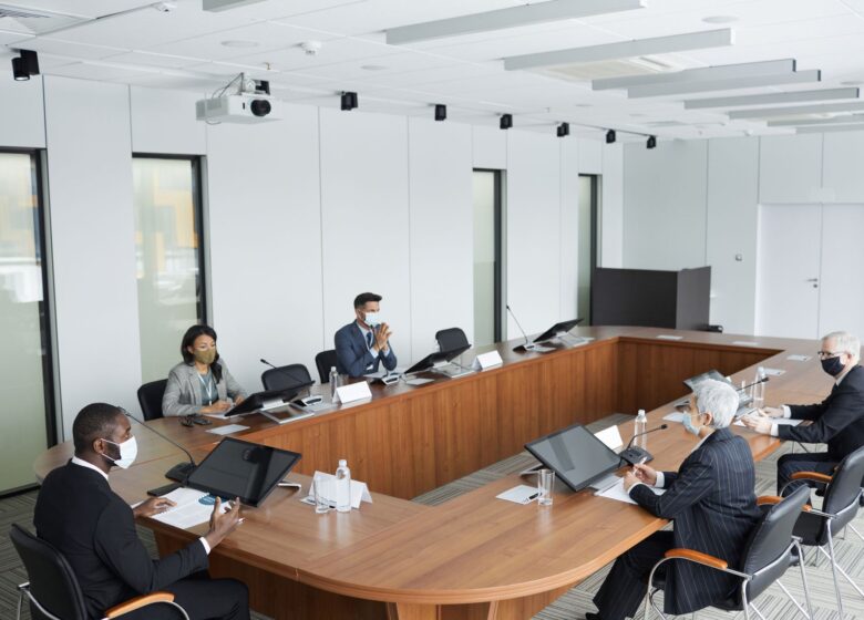 Corporate clients around a boardroom table